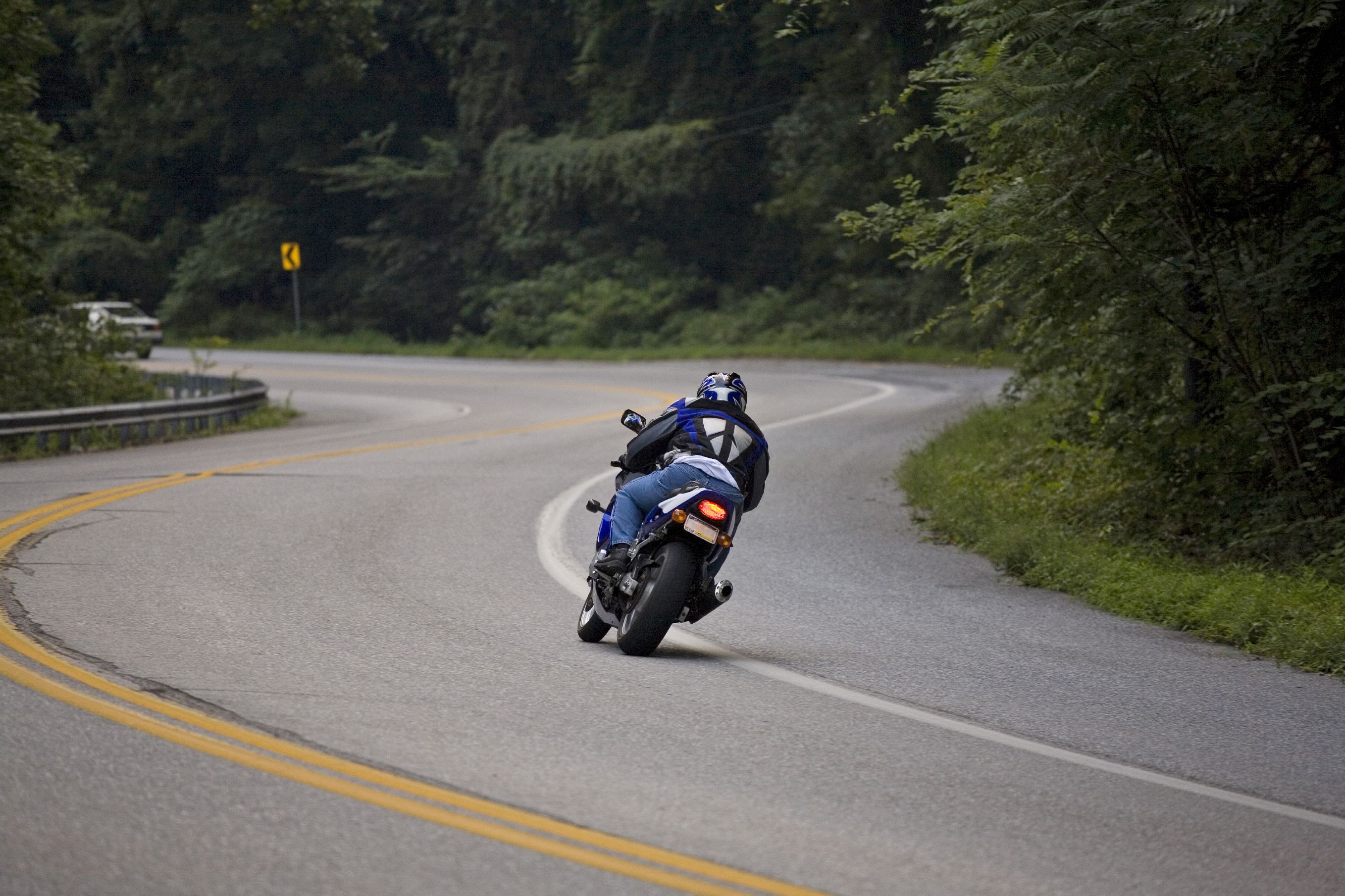 Photo of a motorcyclist on a mountain road