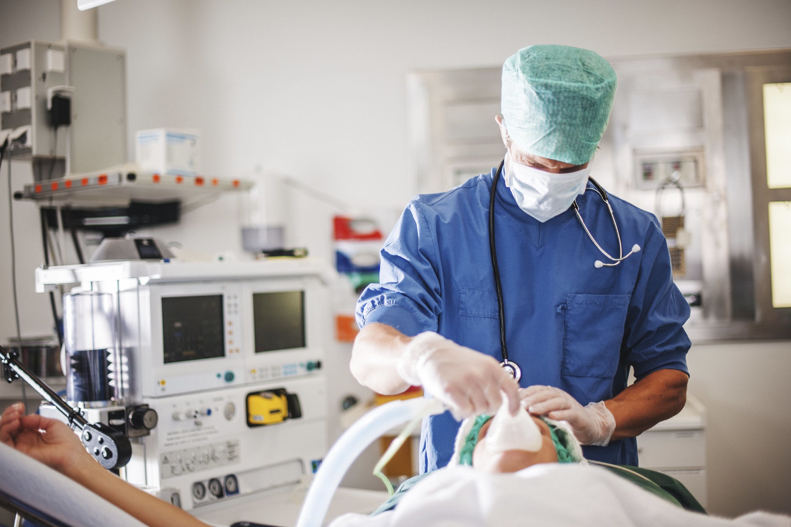 Photo of an anesthesiologist treating a patient